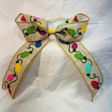 Load image into Gallery viewer, Decorative bow with colorful Christmas lights on a burlap-color fabric and a white backdrop