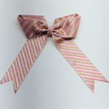 Load image into Gallery viewer, Pink and gold striped bow on a white background
